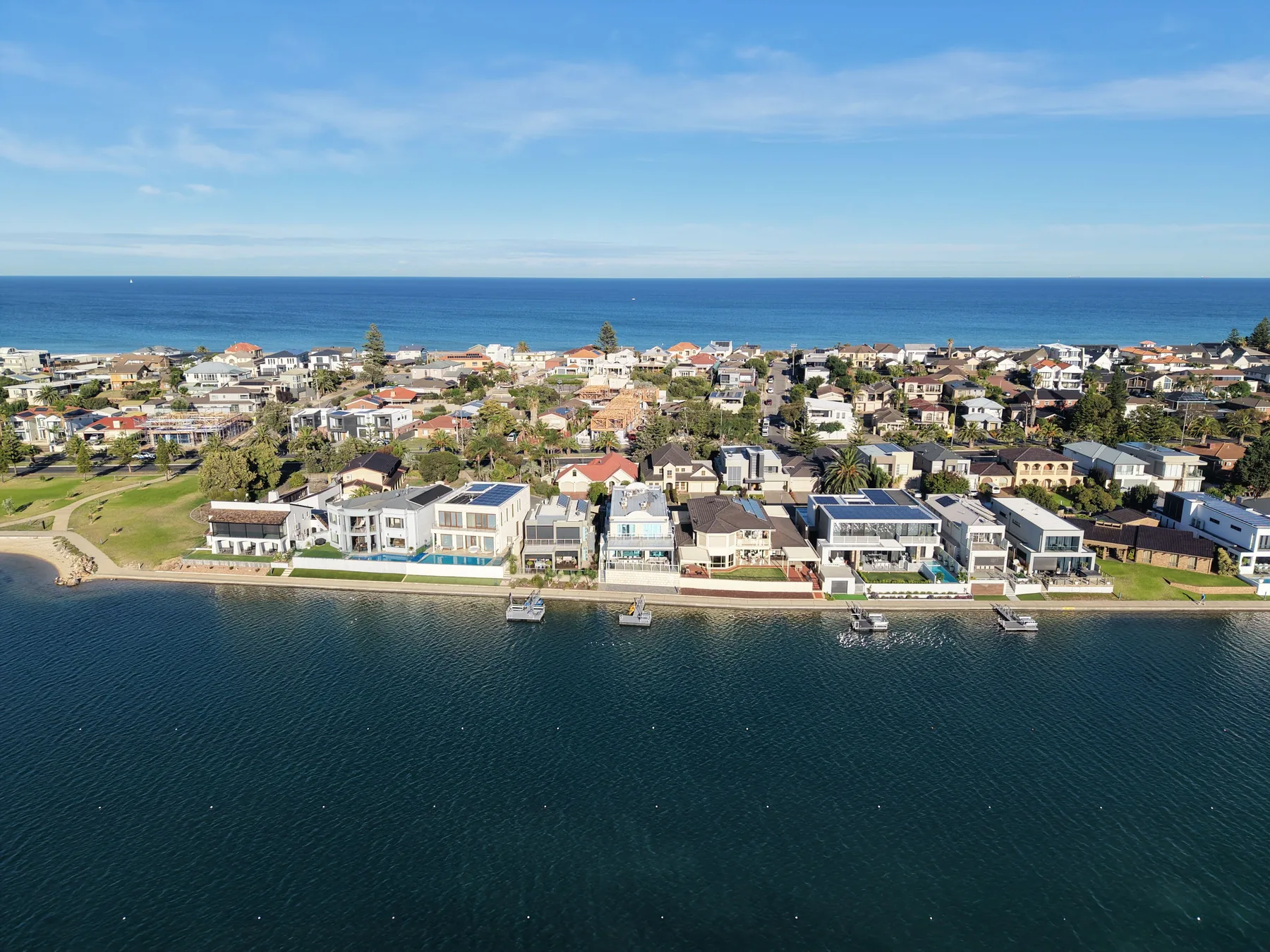 Aerial view of a modern coastal property used as a temporary reference image