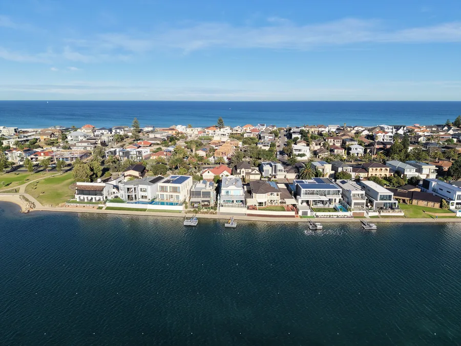 Wide aerial view of a coastal property captured by drone